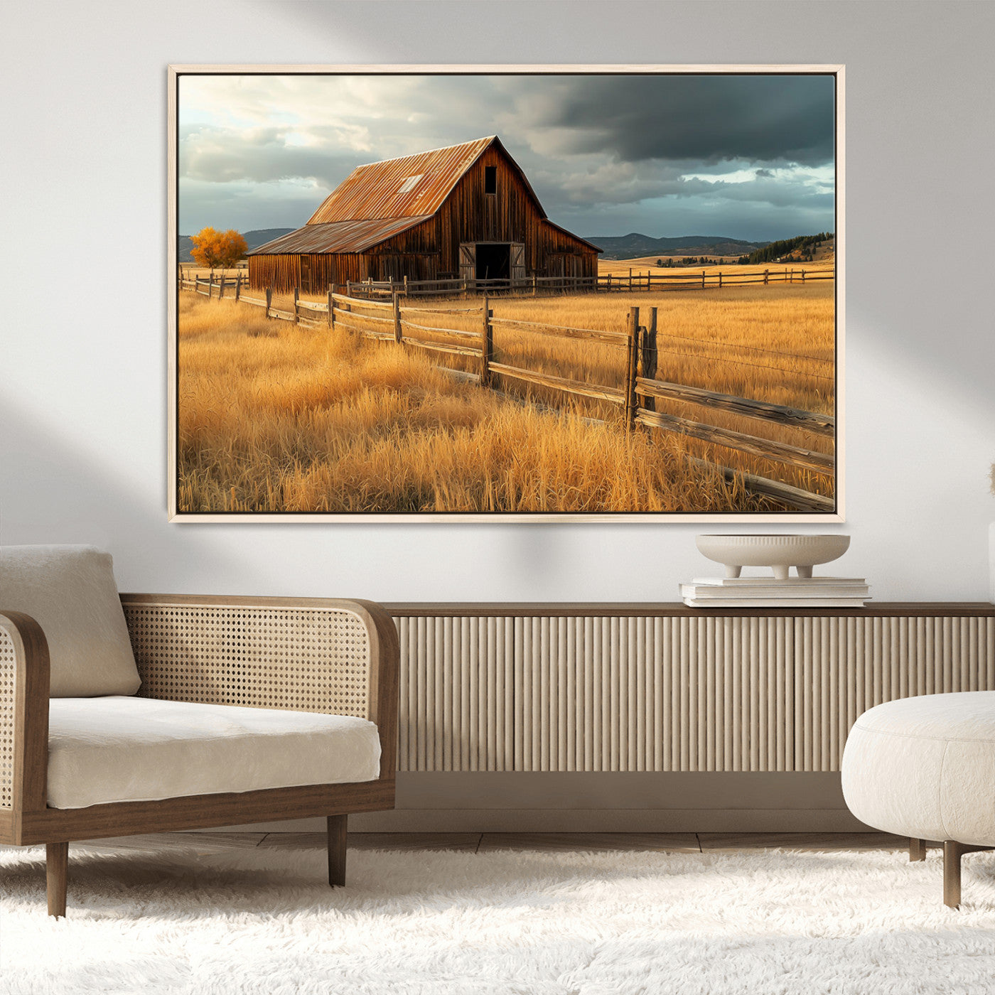 "Golden fields surrounding a rustic barn with a weathered roof, a wooden fence, and dramatic skies with sunlight breaking through the clouds."