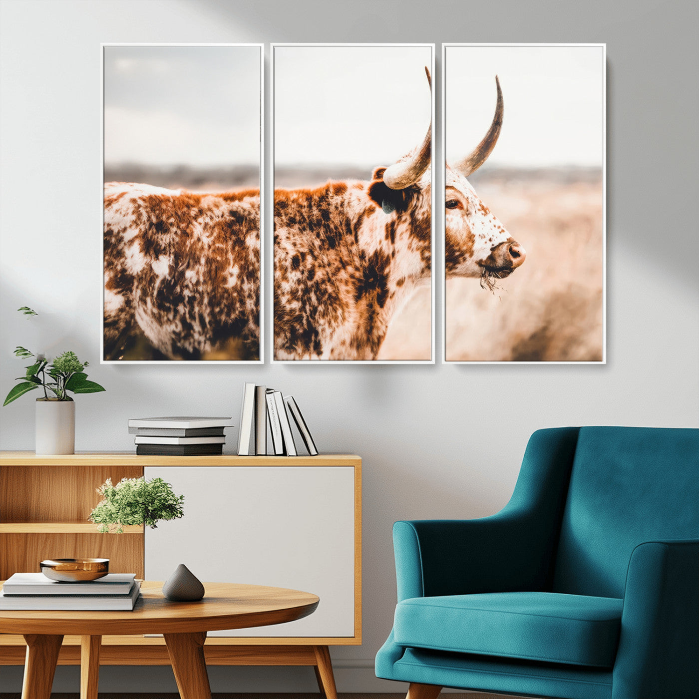 Speckled Texas longhorn with curved horns standing in a warm-toned prairie, perfect for rustic or country-style home decor.