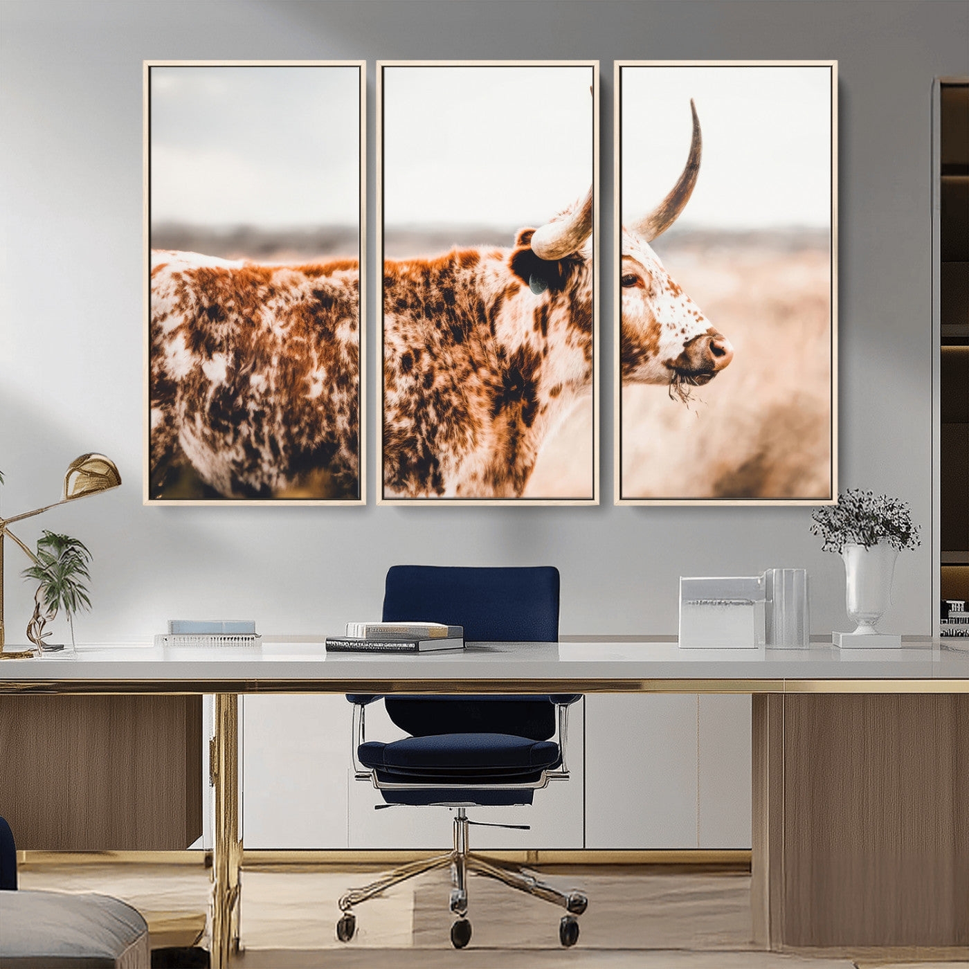 Speckled Texas longhorn with curved horns standing in a warm-toned prairie, perfect for rustic or country-style home decor.
