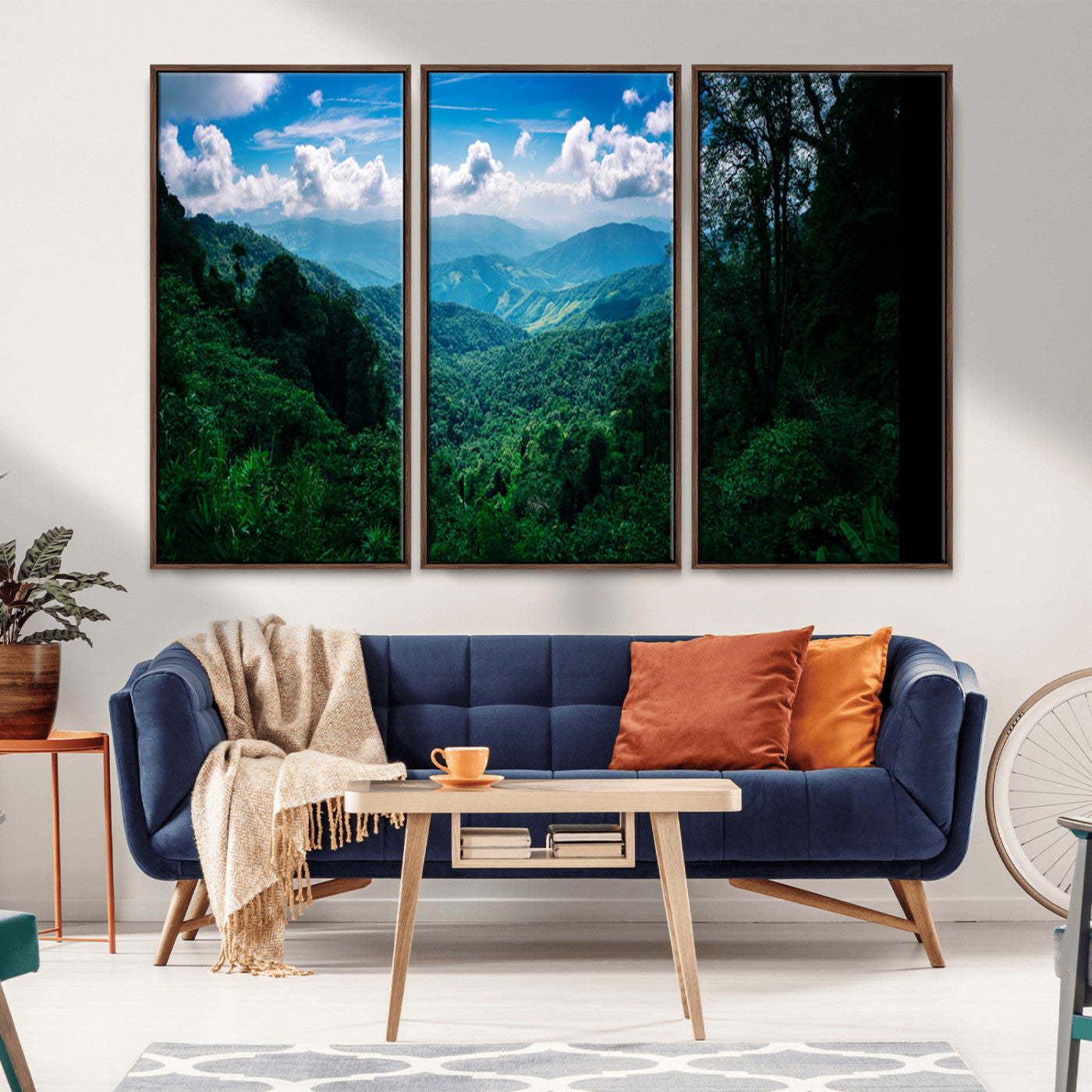 Canvas of a misty tropical jungle with vibrant greenery and layered blue mountains, ideal for exotic nature-themed wall décor.