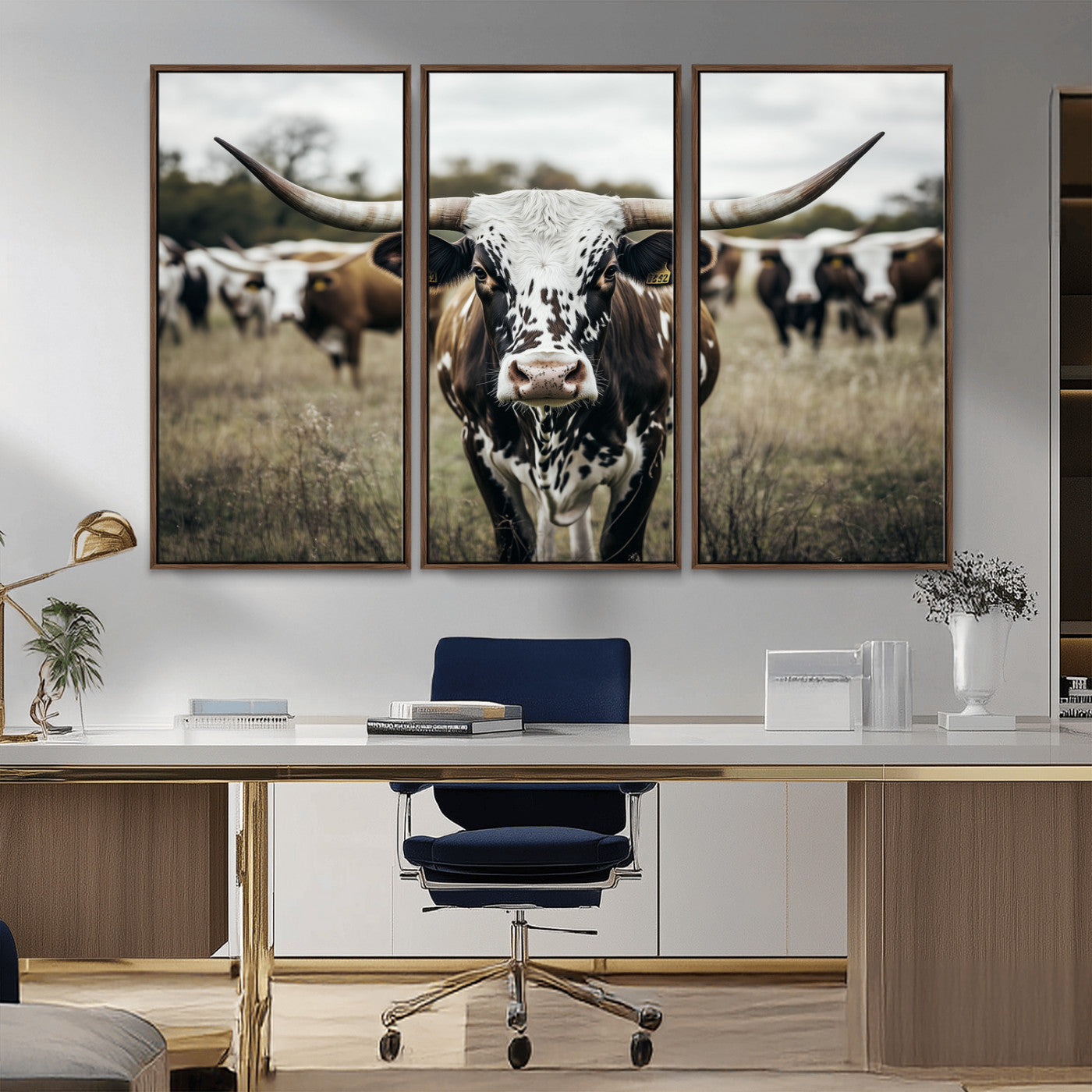 Canvas of a speckled Texas longhorn standing boldly in a field with a herd behind, perfect for rustic western or farmhouse wall decor.