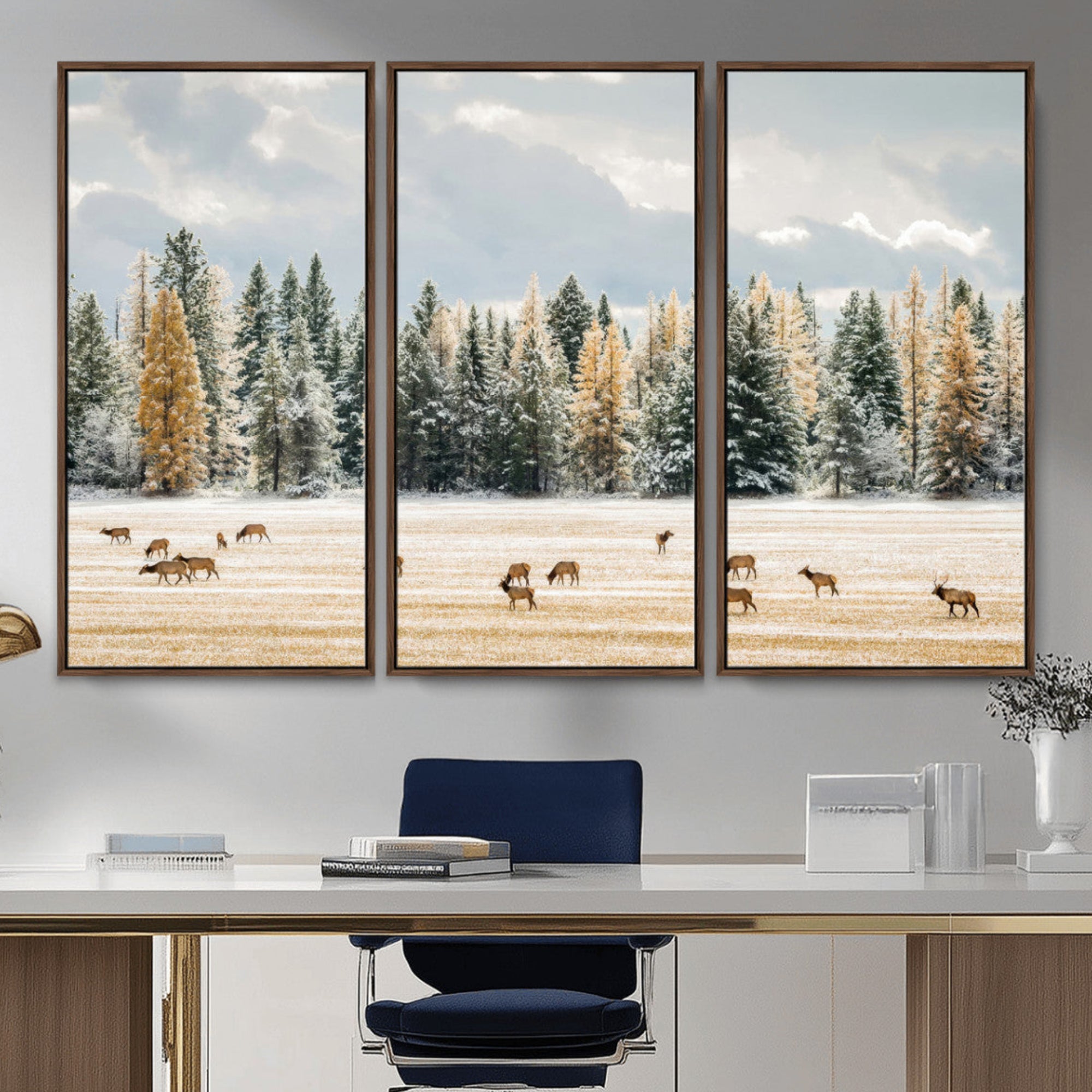 Elk herd in a snowy field with golden pine trees and frosted evergreens, ideal for neutral rustic or cabin-style home decor.