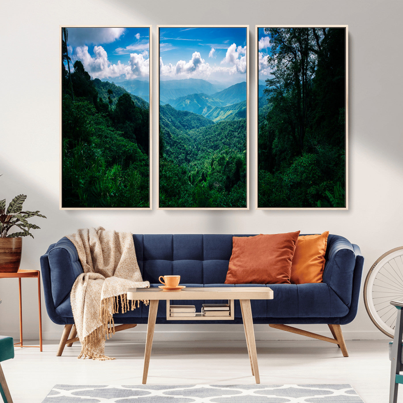Canvas of a misty tropical jungle with vibrant greenery and layered blue mountains, ideal for exotic nature-themed wall décor.