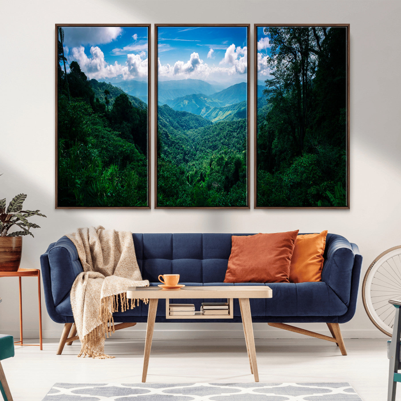 Canvas of a misty tropical jungle with vibrant greenery and layered blue mountains, ideal for exotic nature-themed wall décor.