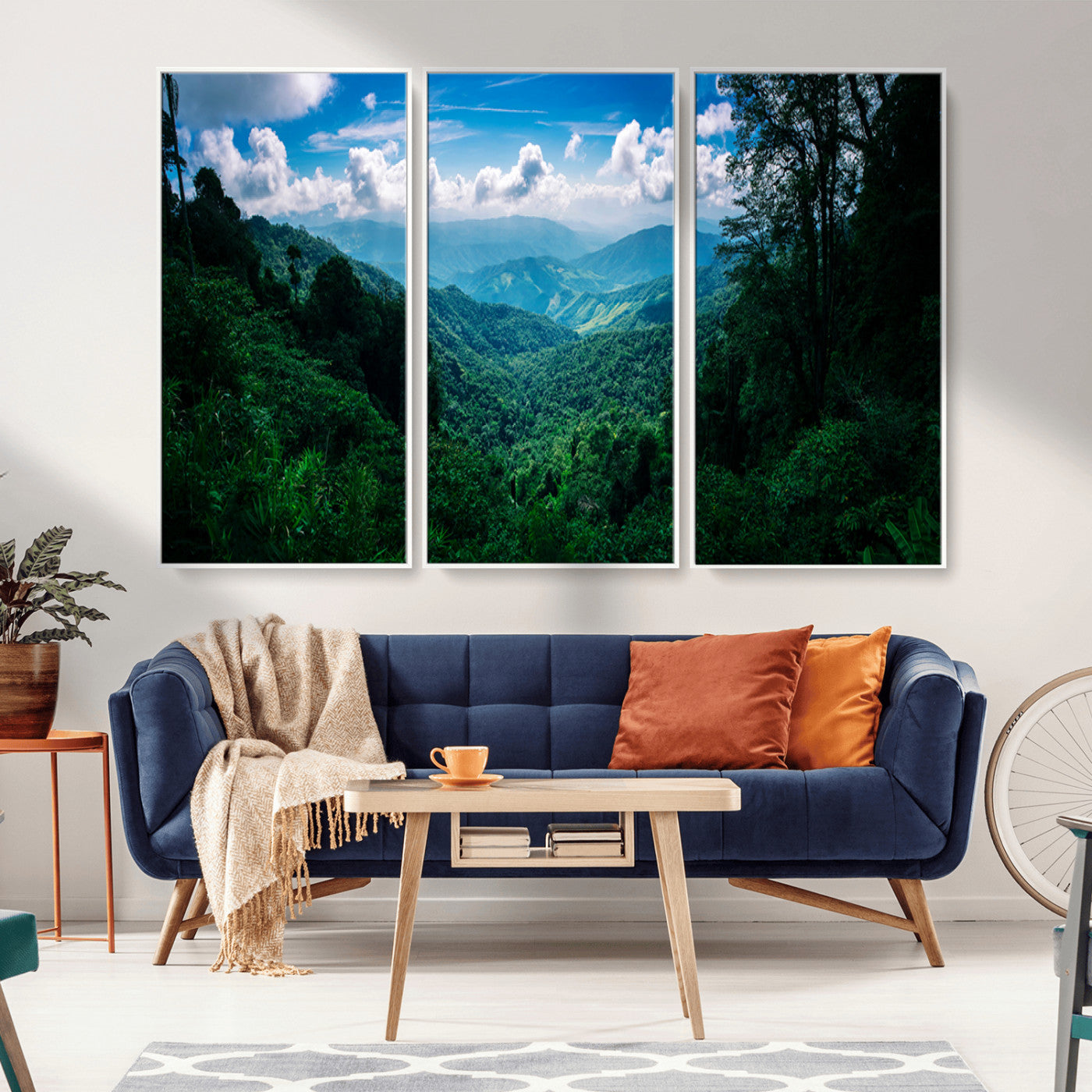 Canvas of a misty tropical jungle with vibrant greenery and layered blue mountains, ideal for exotic nature-themed wall décor.