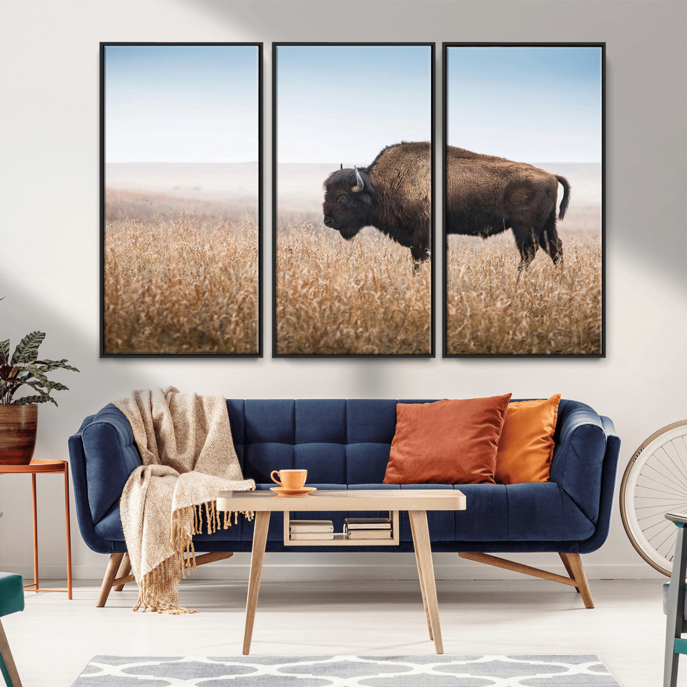 A solitary American bison stands in a dry grassland under soft skies, ideal for rustic or western-style home decor in warm neutral tones.
