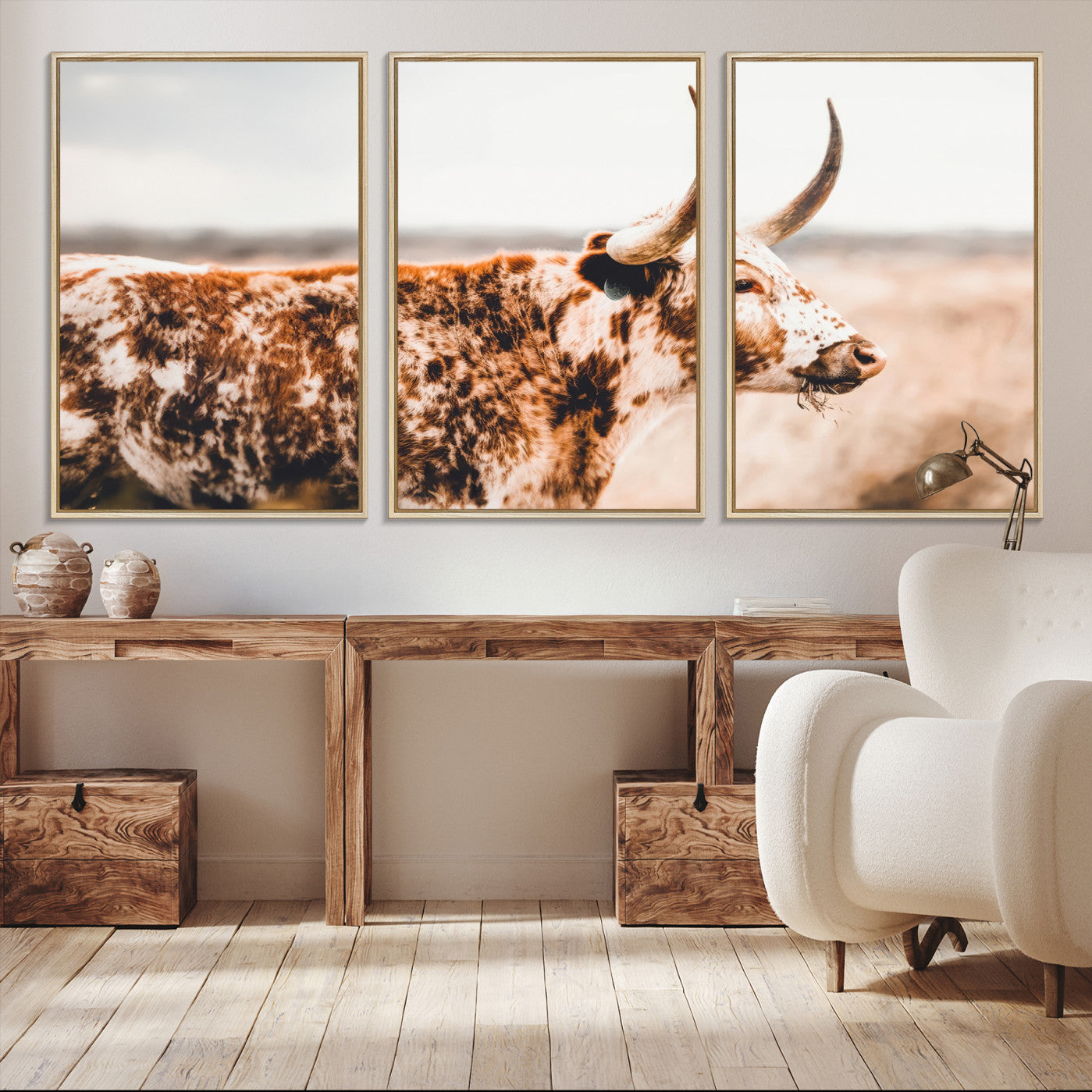 Speckled Texas longhorn with curved horns standing in a warm-toned prairie, perfect for rustic or country-style home decor.