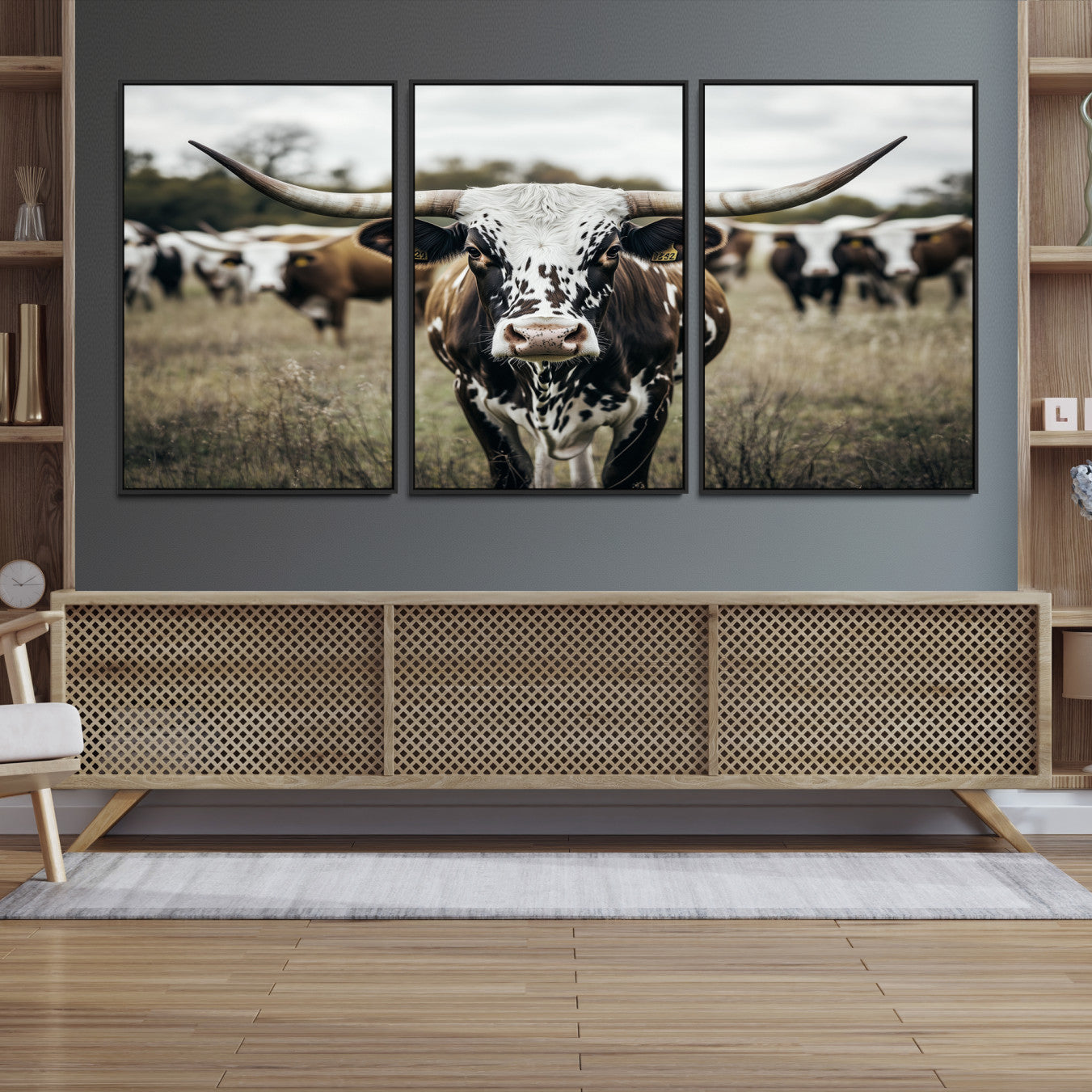 Canvas of a speckled Texas longhorn standing boldly in a field with a herd behind, perfect for rustic western or farmhouse wall decor.