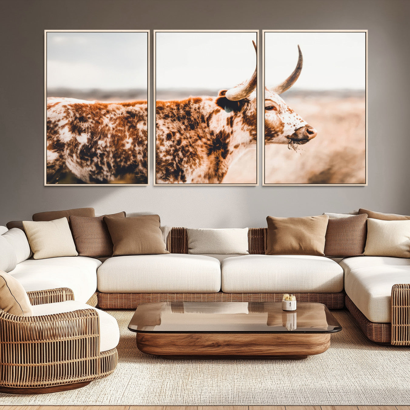 Speckled Texas longhorn with curved horns standing in a warm-toned prairie, perfect for rustic or country-style home decor.