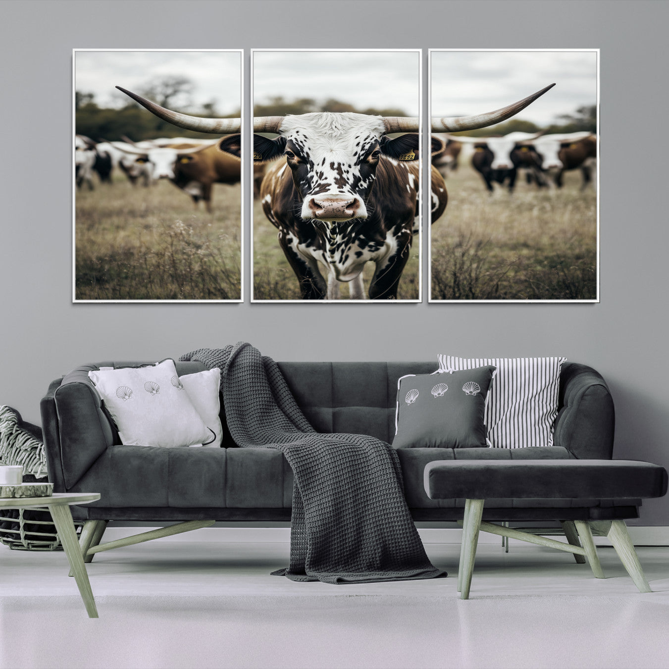 Canvas of a speckled Texas longhorn standing boldly in a field with a herd behind, perfect for rustic western or farmhouse wall decor.