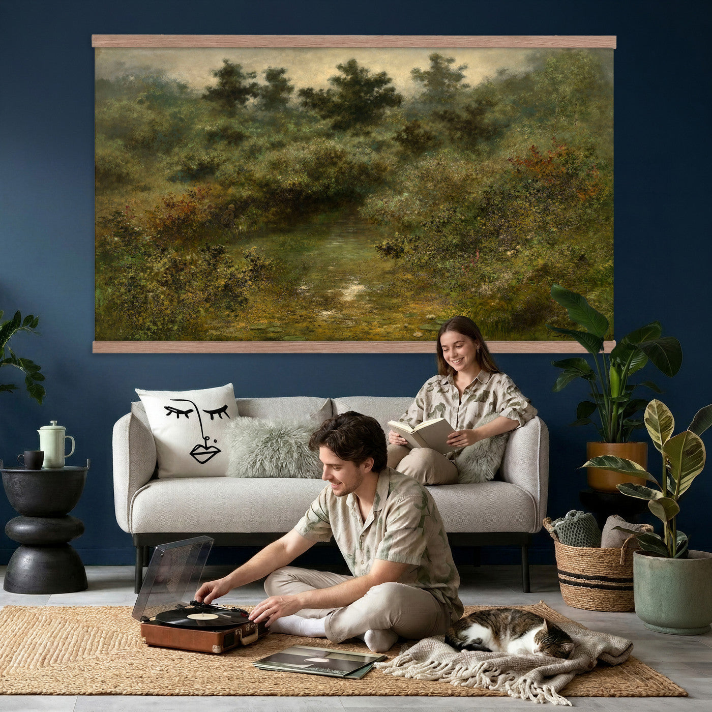 66880646-MGV-TP-30X20 - Barbizon oil painting tapestry wall hanging of "By the Brook" by Xavier De Cock, showing a shaded brook winding through dense woodland, with a small hidden figure resting among the trees in dark layered forest greens with warm brown earth and pale water light. Extra large wall art, made in the USA.