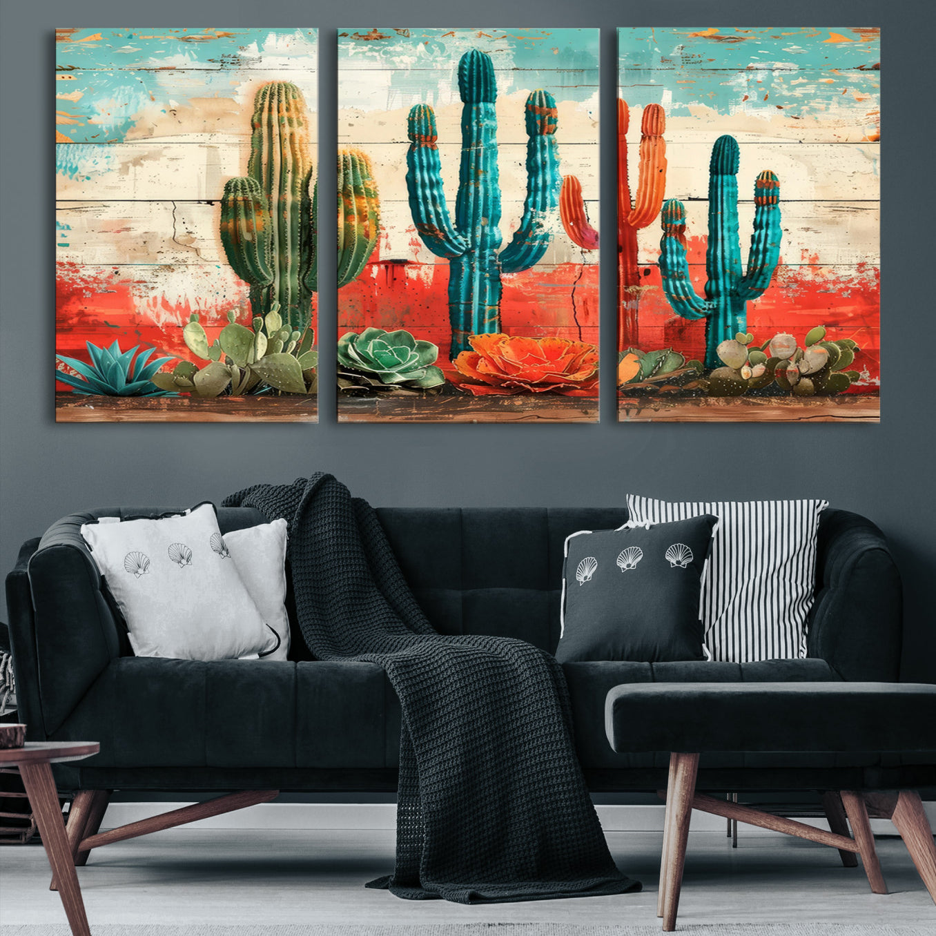 A vivid southwestern-style artwork featuring an eclectic mix of cacti and succulents painted against a textured, rustic wood backdrop in rich turquoise, red, and orange hues.