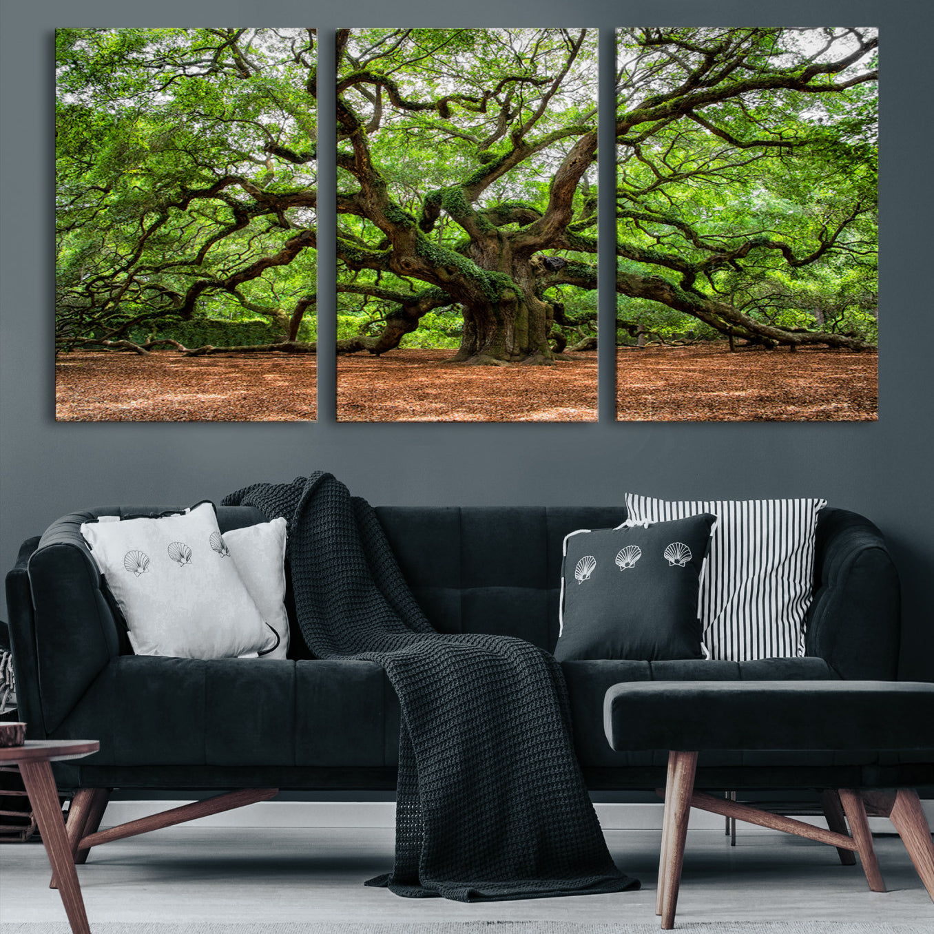 A majestic, ancient tree with expansive, twisting branches spreading wide under a dense, vibrant green canopy in a serene forest clearing.