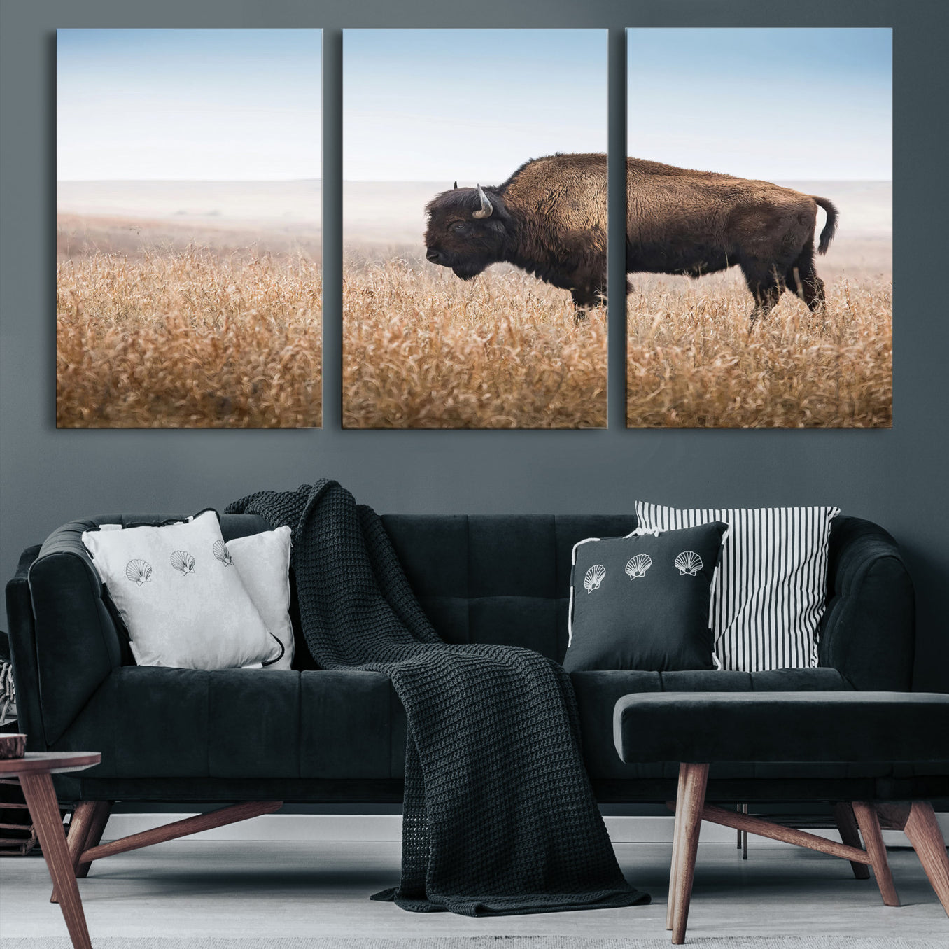 A solitary American bison stands in a dry grassland under soft skies, ideal for rustic or western-style home decor in warm neutral tones.