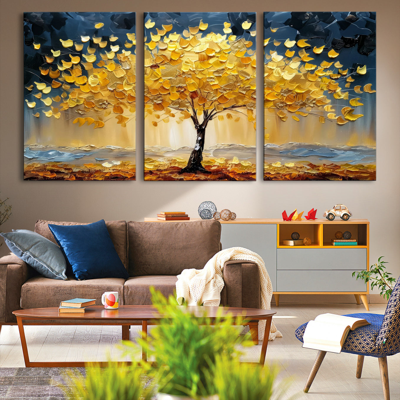 Canvas of a golden autumn tree with textured brushstrokes and moody blue skies, perfect for dramatic and vibrant home decor.