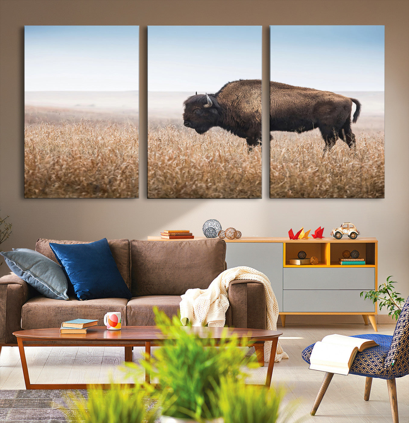 A solitary American bison stands in a dry grassland under soft skies, ideal for rustic or western-style home decor in warm neutral tones.