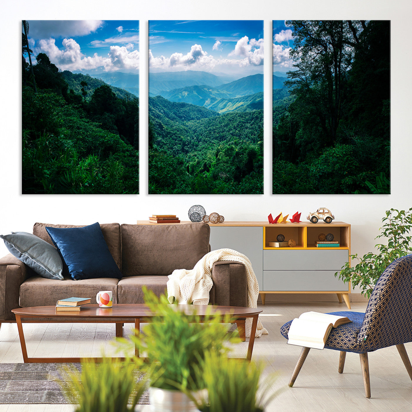 Canvas of a misty tropical jungle with vibrant greenery and layered blue mountains, ideal for exotic nature-themed wall décor.