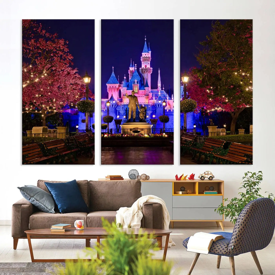 A living room showcases a three-panel wall art of a colorful castle at night, surrounded by illuminated trees.