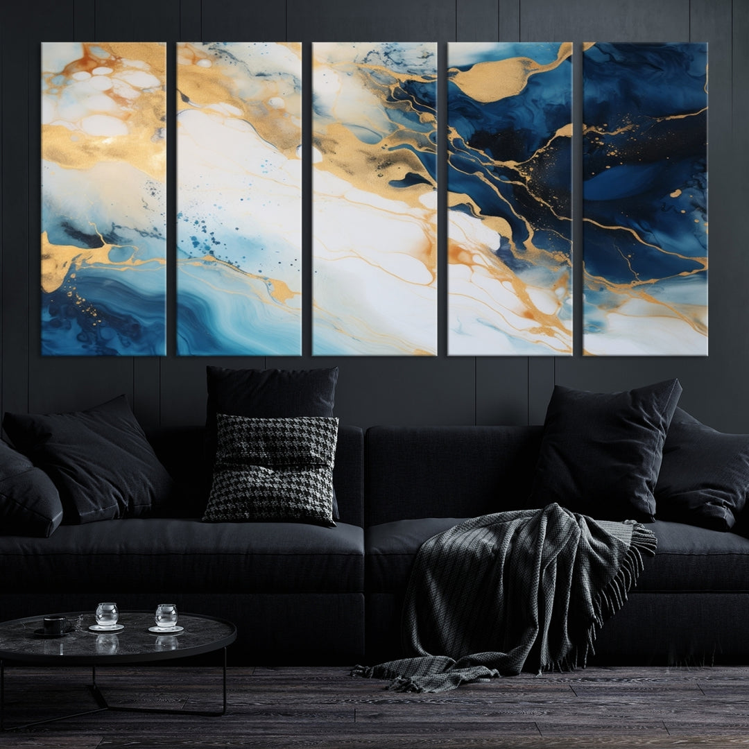 A modern living room featuring museum-quality Blue Gold Abstract Wall Art Print Contemporary art in a triptych arrangement.