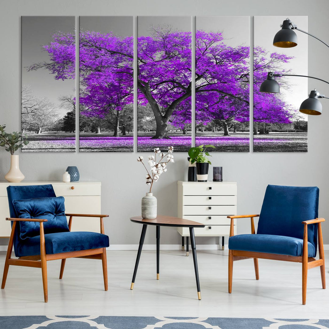 The Big Purple Tree Wall Art Canvas Print showcases a vibrant purple tree set against a black-and-white landscape.