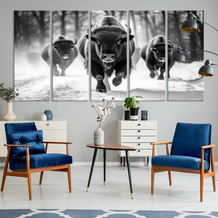 The Buffalo Wall Art Canvas Print of bison running through snow adorns the wall.