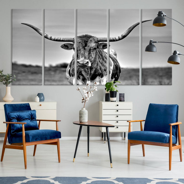 The Texas Longhorn Cow wall art, divided into three panels, is of gallery quality and displayed on a dark wall.