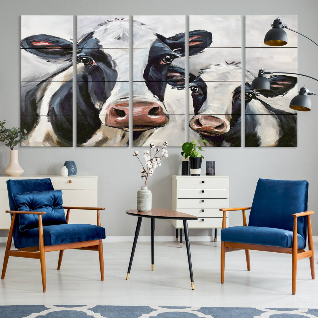 The Vintage Baby and Mom Cattle Canvas, featuring cows with black and white patches, is a prominent piece of wall art.