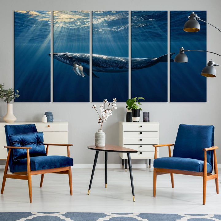 The Whale under Ocean wall art canvas print graces the white wall.