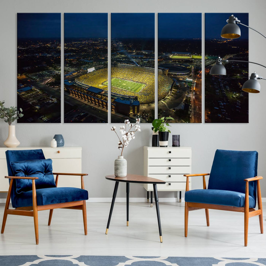 Aerial view of Michigan Stadium at night, surrounded by city lights, depicted on a Michigan Wolverines wall art canvas print.