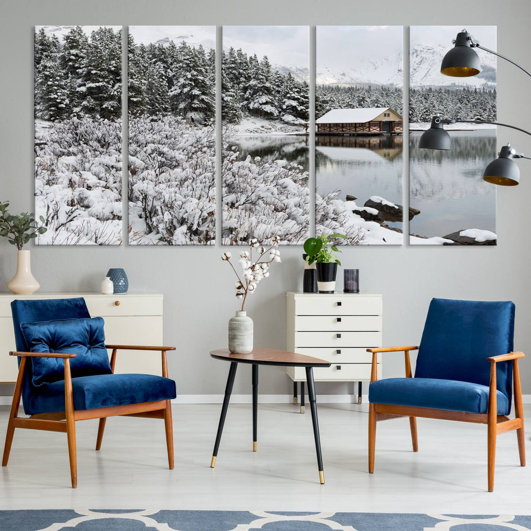 Experience the beauty of winter with the "Cabin by the Lake Canvas Wall Art," showcasing a serene snowy landscape. This rustic nature decor features a cozy cabin nestled amid snow-laden trees, set against a breathtaking mountain view, perfect for enhancing your living room.