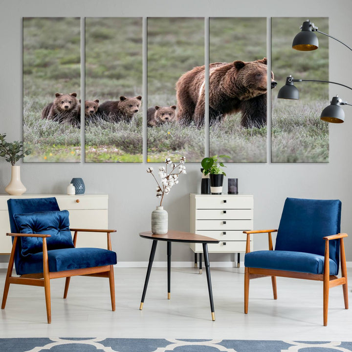 The large canvas print titled "Queen of the Tetons, 399 Grizzly Bear Cubs" showcases majestic wildlife photography of a bear and her cubs walking through the grass. This stunning canvas wall art, handmade in the USA, adds a charming touch to any room with its rustic decor appeal.