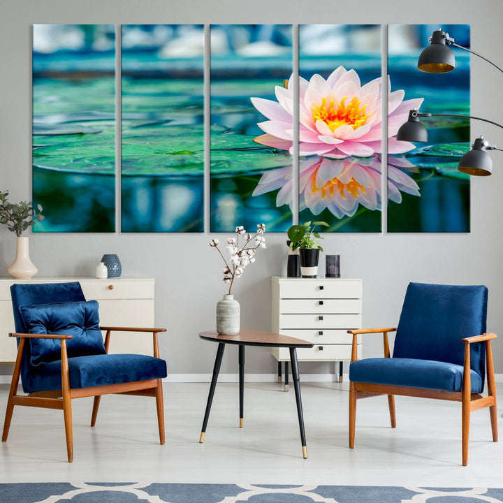 The Lotus Flower Canvas Print showcases a pink water lily with a yellow center gracefully floating on a calm pond.