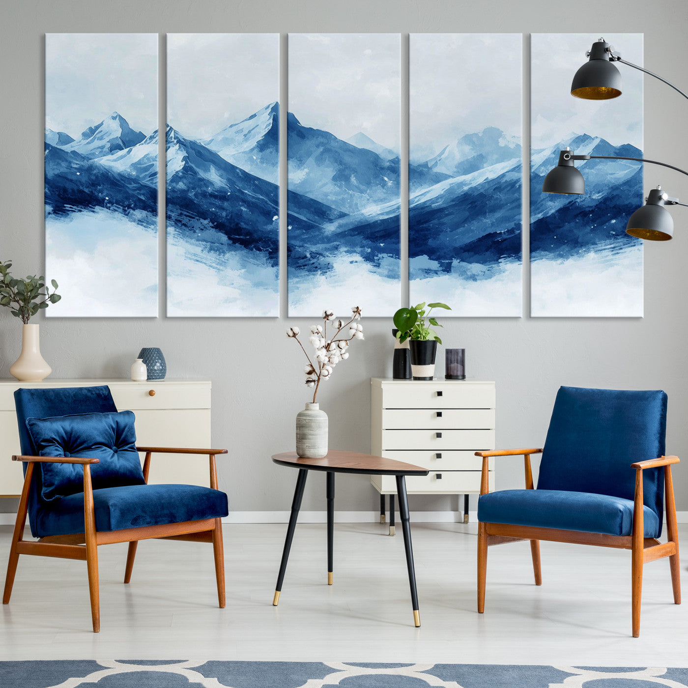 Peaceful watercolor-style painting of snowy blue mountains in soft tones, perfect for winter-themed or minimalist wall decor.