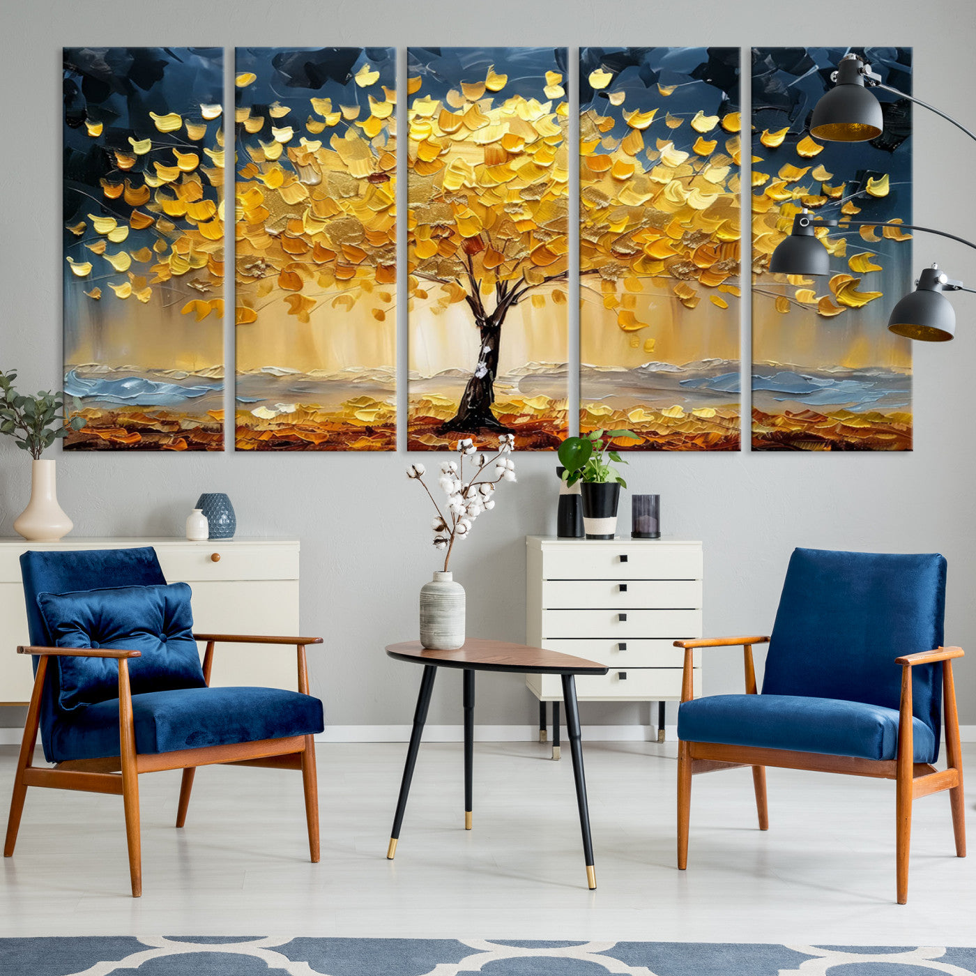 Canvas of a golden autumn tree with textured brushstrokes and moody blue skies, perfect for dramatic and vibrant home decor.