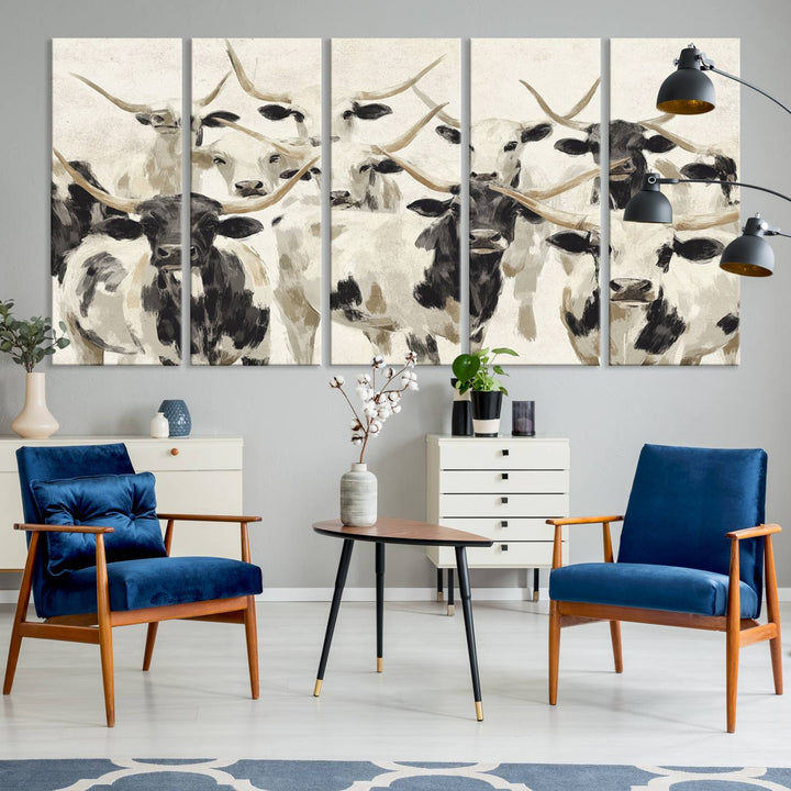 Canvas print titled Longhorn Texas Cow Drawing, depicting longhorn cattle with black and white markings, made in the USA, displayed on the wall.