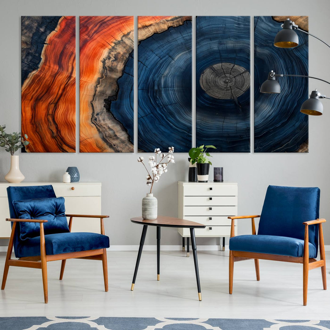 Abstract Tree Ring Wall Art Print on canvas featuring vibrant blue, orange, and brown rings with a natural rustic wood texture. Free shipping available!.