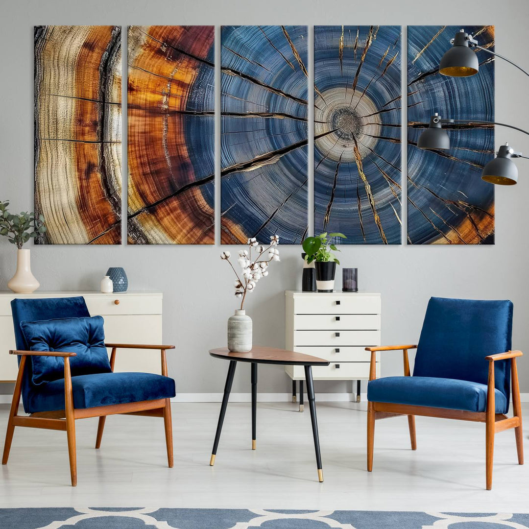 Close-up of blue, brown, and orange wood grain rings on the Abstract Tree Rings Canvas Wall Art Print.