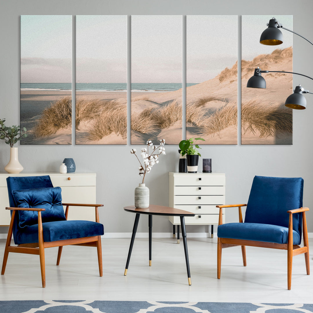 Soft pastel-toned beach scene with sand dunes, windswept grasses, and a calm ocean horizon, creating a serene coastal atmosphere.