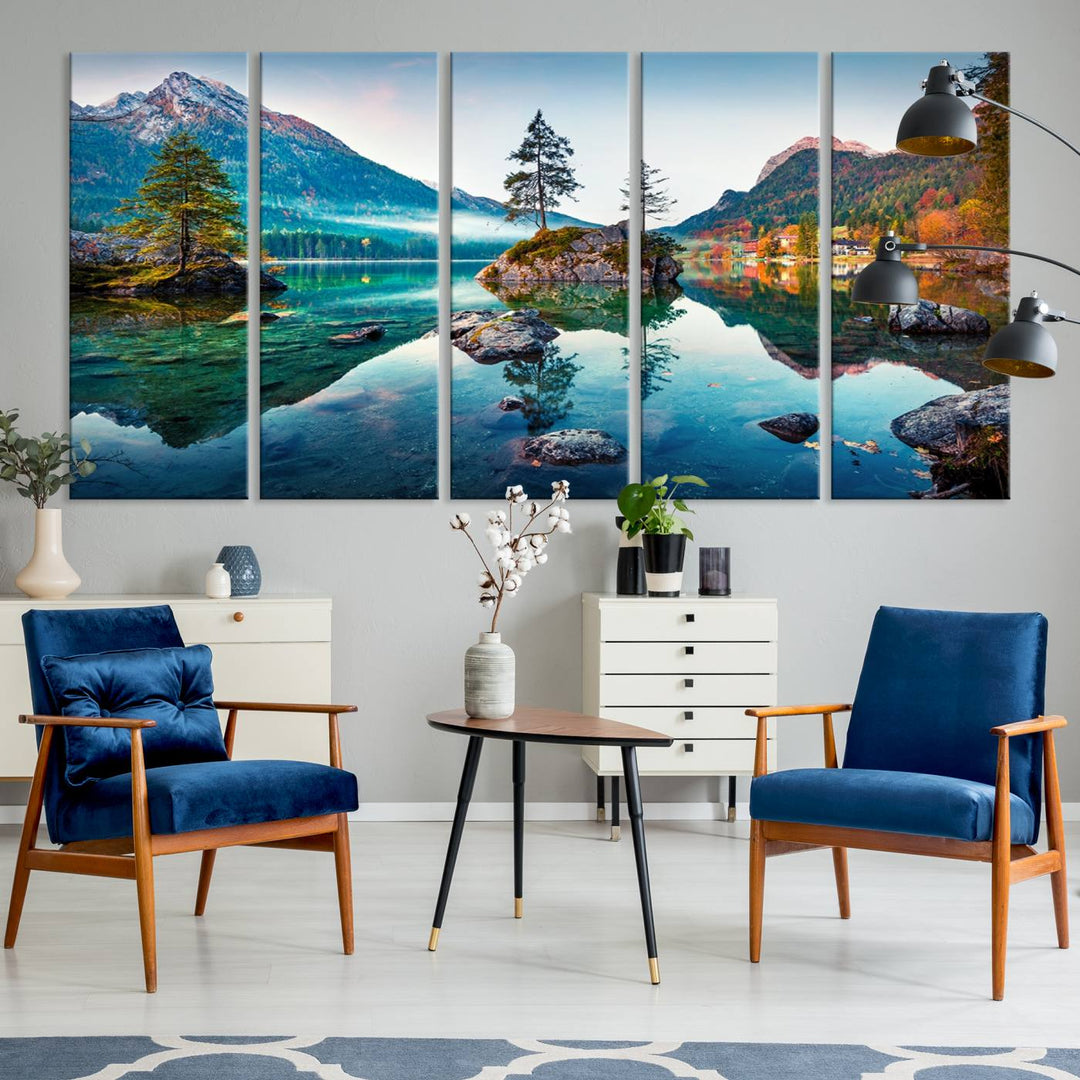 The 3-panel wall art showcases a serene mountain lake with rocky islands and trees, creating an ideal focal point for dining rooms or offices.