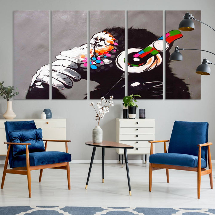 A vibrant triptych, the "DJ Monkey Listening to Music" wall art print, features a Banksy-inspired large canvas adorned with colorful modern pop art. This striking piece elegantly enhances the room with its dynamic and lively depiction.