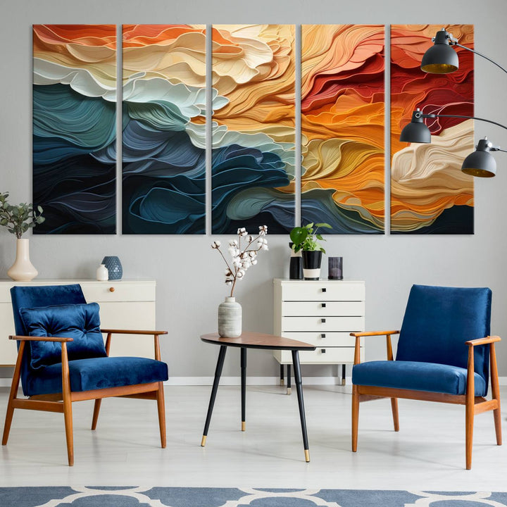 A Blue Orange Abstract Wave Wall Art Canvas Print adorns the wall. This colorful masterpiece is professionally hand-assembled to enhance any space.