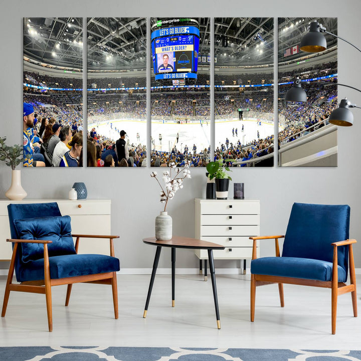 Wall art prints depicting the bustling scenes of the St. Louis Blues being cheered on by a full house at the Enterprise Center, beneath a large scoreboard.