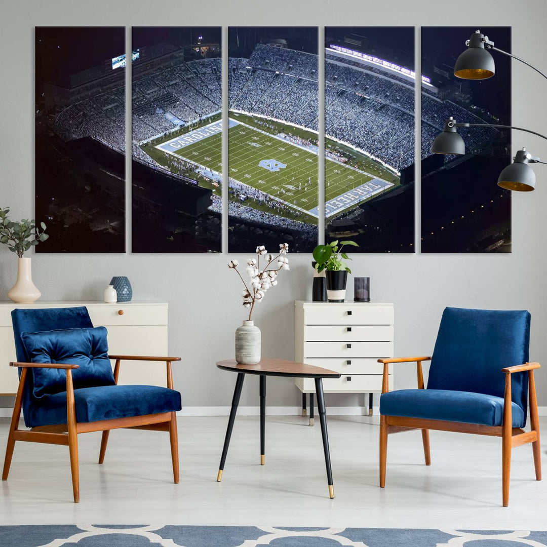 A University of North Carolina Tar Heels Football Team Print, showcasing Chapel Hill's Kenan Memorial Stadium, hangs in a modern dining room, adding a gallery-quality finish that enhances the entire space.