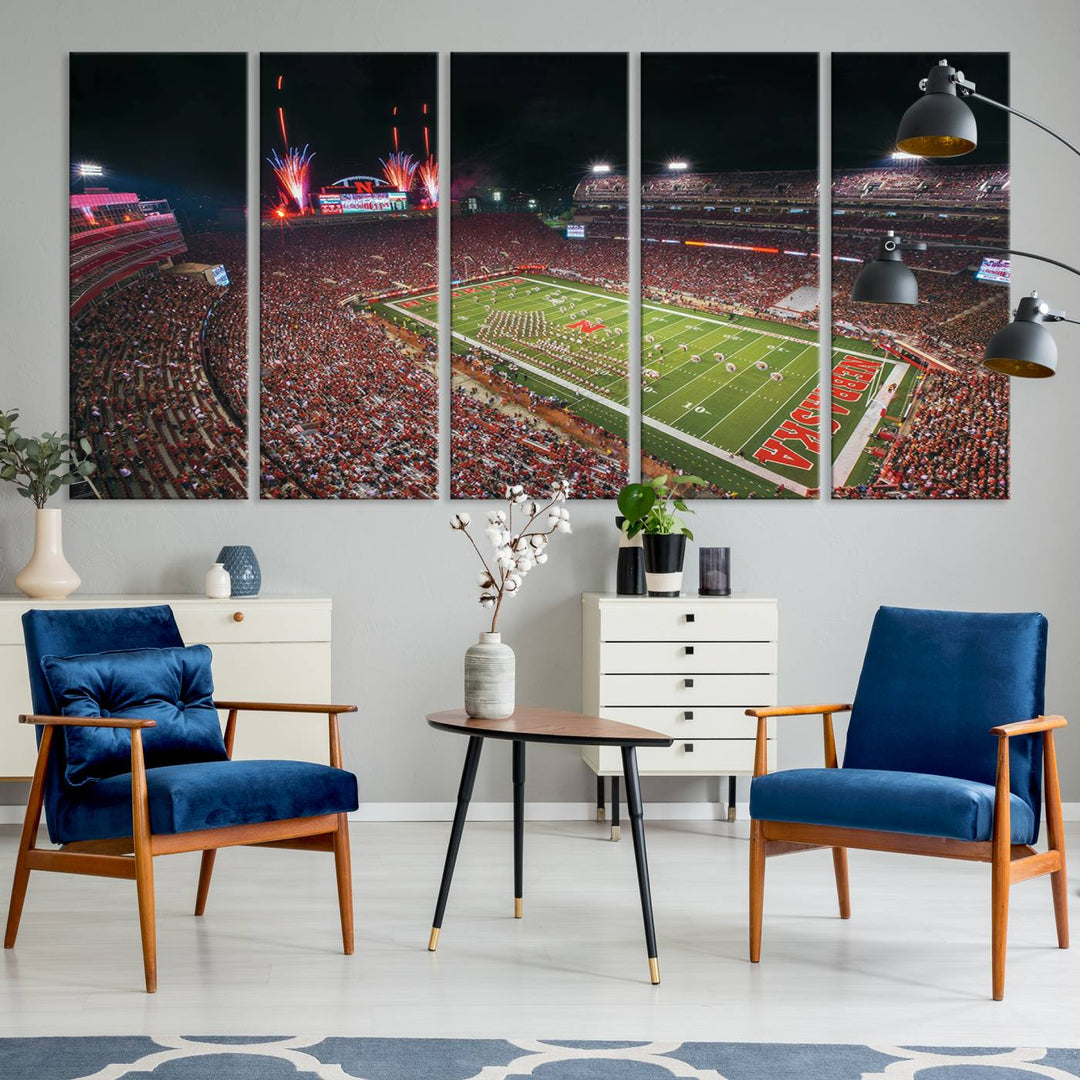 The University of Nebraska Cornhuskers Football Team Print, featuring Lincoln Memorial Stadium in a vibrant triptych canvas with fireworks above and a gallery-quality finish, is elegantly displayed.