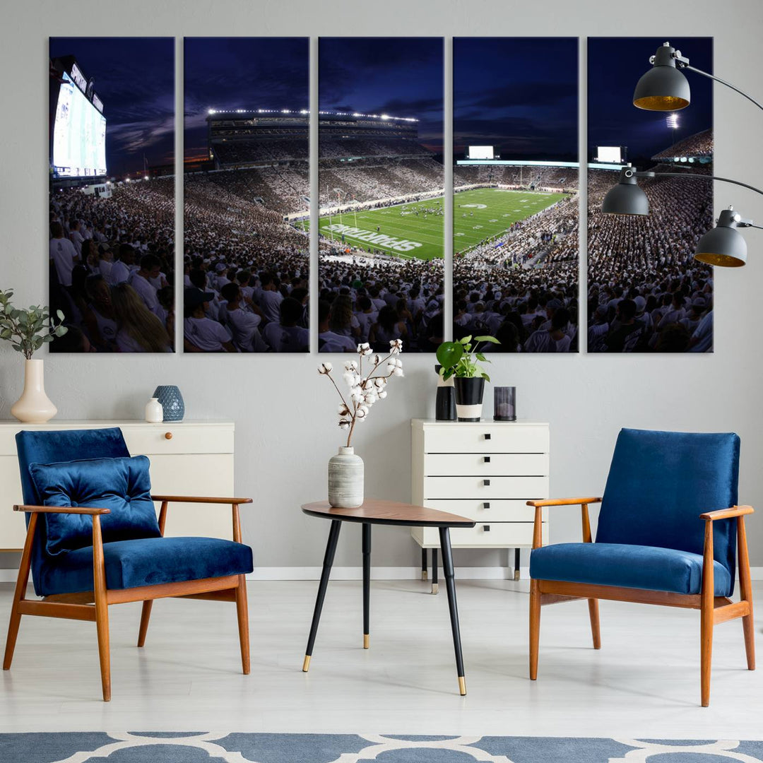 A packed football stadium at night, with bright lights and fans in white, depicted in a Michigan State Spartans Stadium wall art.