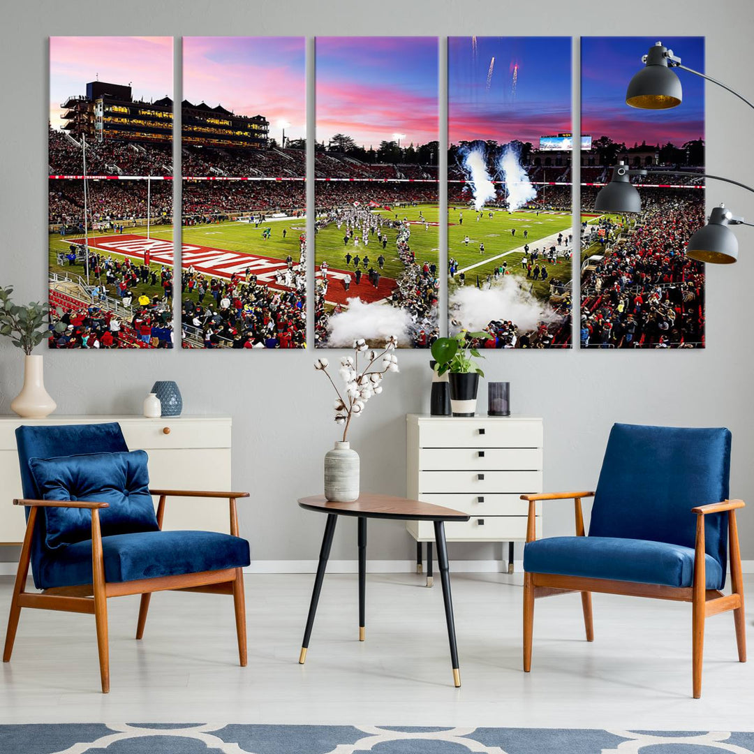 The wall art features a canvas print of the Stanford Cardinal football team, capturing players, fireworks, and smoke against the backdrop of a sunset at Stanford Stadium.