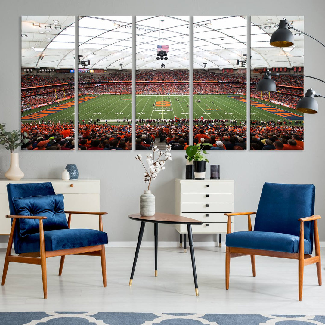 Fans fill the Syracuse JMA Wireless Dome, highlighted in orange and blue under a vaulted roof on this premium canvas print of the scene.