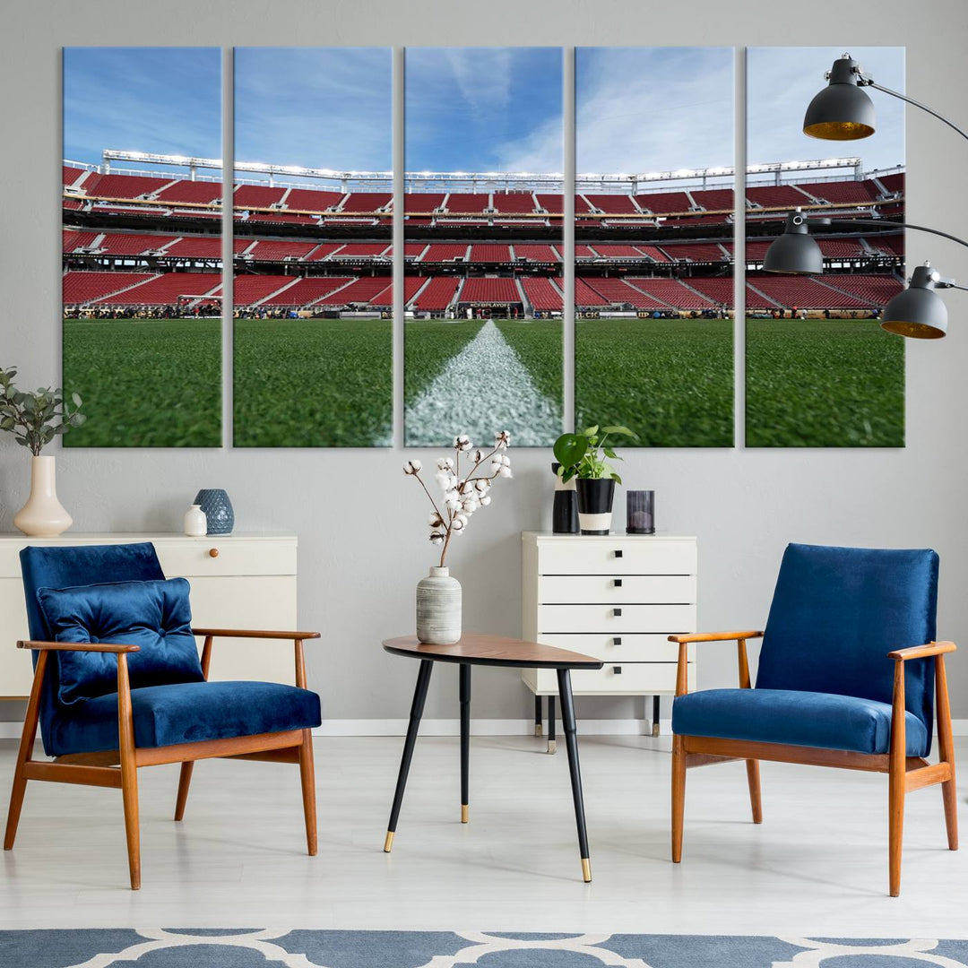 A canvas print of the University of Tulsa Golden Hurricane showcases H.A. Chapman Stadiums football field and red seats against a backdrop of a blue sky.