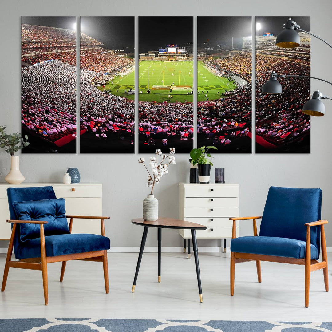 The Maryland Terrapins Football Wall Art Canvas showcases a packed SECU Stadium at night with a bright field and cheering fans.