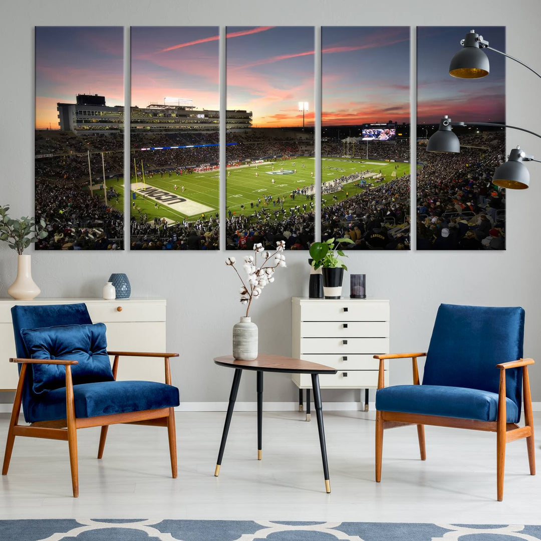 This wall art canvas print captures UCONN Huskies fans energizing a sunset scene at East Hartfords Pratt & Whitney Stadium.